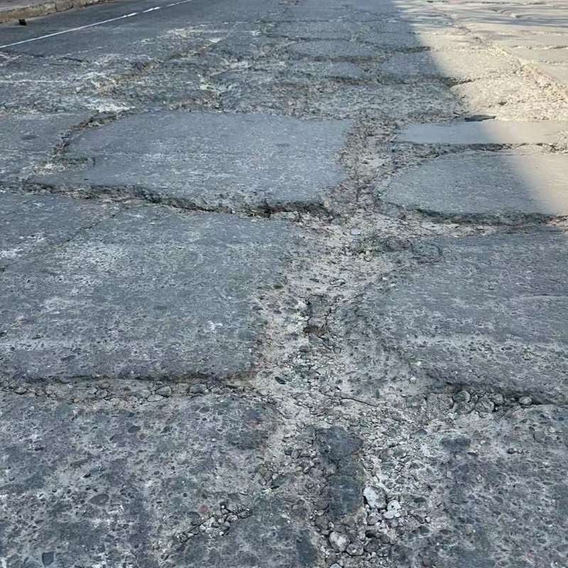 友谊路面起砂露石子修补料